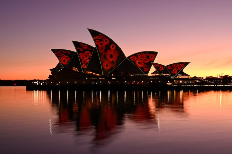 The sails of the Sydney Opera House illuminated with poppies at dawn to mark Remembrance Day in Australia. Reuters