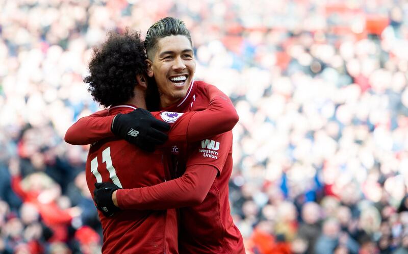 Liverpool's Roberto Firmino, left, celebrates putting Liverpool 2-1 ahead against Burnley. EPA