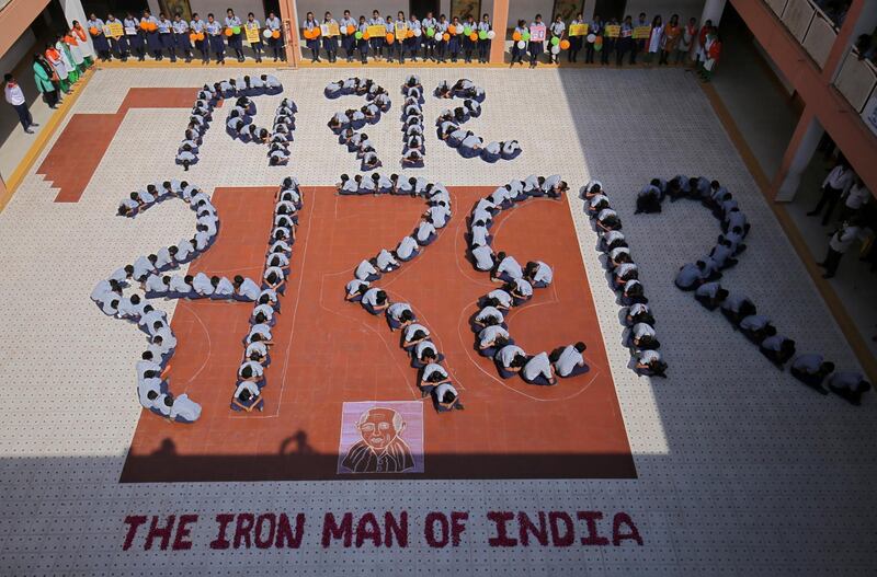 Students sit in formation to pay tribute to Sardar Vallabhbhai Patel, one of the founding fathers of India, ahead of the unveiling of the Statue of Unity portraying Patel. Reuters