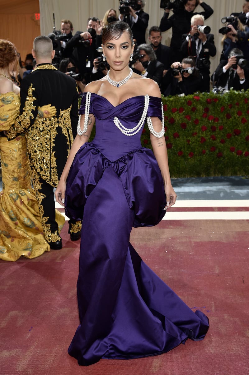 Anitta, wearing purple peplum Moschino. AP Photo