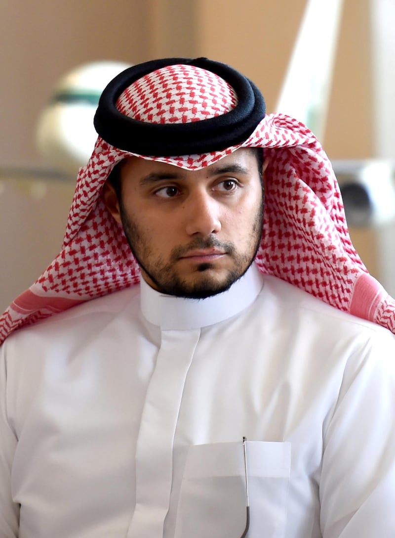 Khaled Alwaleed bin Talal, the son of Saudi Arabia's billionaire Prince Alwaleed bin Talal, looks on as his father speaks during a press conference in the Saudi capital, Riyadh, on July 1, 2015. Alwaleed pledged his entire $32-billion (28.8-billion-euro) fortune to charitable projects over the coming years. The prince said in a statement that the "philanthropic pledge will help build bridges to foster cultural understanding, develop communities, empower women, enable youth, provide vital disaster relief and create a more tolerant and accepting world." AFP PHOTO / FAYEZ NURELDINE (Photo by FAYEZ NURELDINE / AFP)
