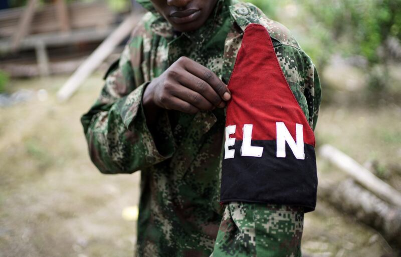 A rebel of Colombia's Marxist National Liberation Army (ELN) shows his armband while posing for a photograph, in the northwestern jungles, Colombia August 31, 2017. Picture taken August 31, 2017. REUTERS/Federico Rios