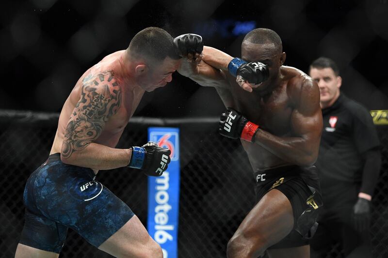 Kamaru Usman (red gloves) fights Colby Covington during UFC 245 at T-Mobile Arena. USA Today