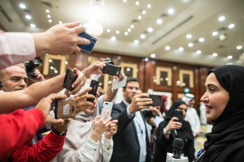 Candidate Maryam Bin Thaniah (R) celebrates after winning one of the seats for the Emirate of Dubai during the fourth session of Federal National Council elections at a polling station in Dubai, UAE.  EPA