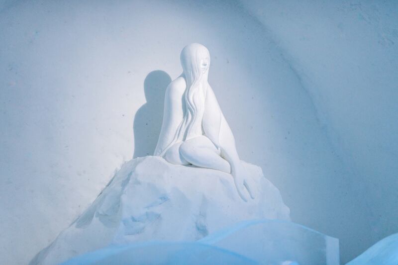 A folkloric seal maiden sits on an icy throne inside a suite by sisters and artists Emilie and Sara Steele. Photo: Asaf Kliger