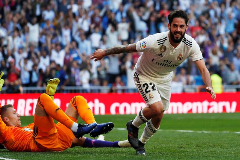 Real Madrid's Isco celebrates scoring their first goal. Reuters