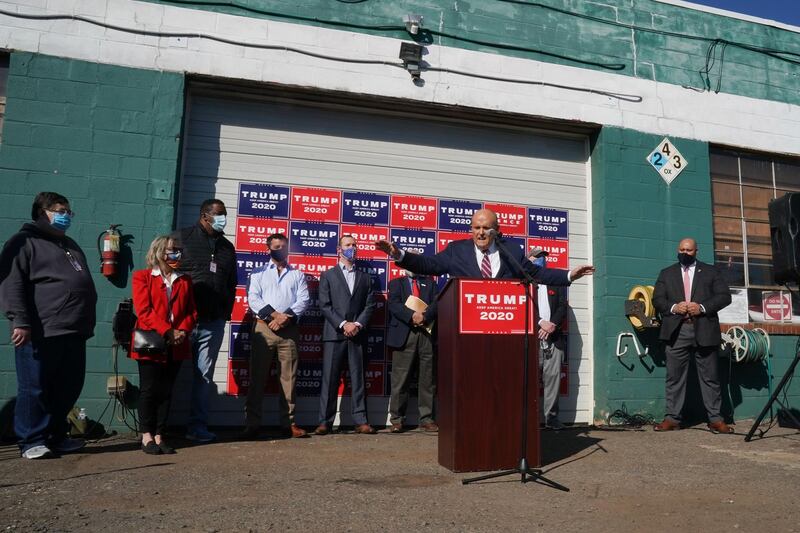 Rudy Giuliani, speaks at a news conference in the parking lot of a landscaping company on November 7, 2020 in Philadelphia. 
AFP