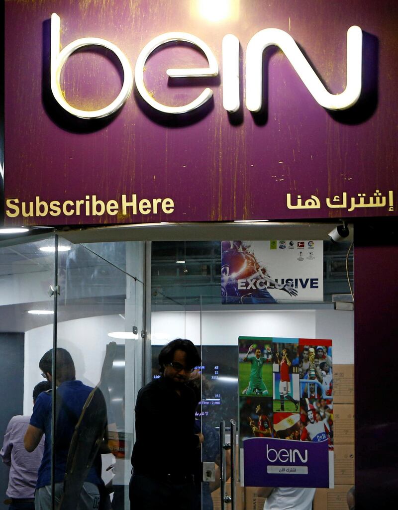 Egyptian clients wait at one of the outlets of Qatari-funded beIN Sports channel in Cairo, Egypt June 12, 2018. Picture taken June 12, 2018. REUTERS/Mohamed Abd El Ghany