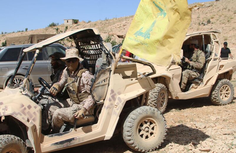A picture taken on July 29, 2017 during a tour guided by the Lebanese Shiite Hezbollah movement shows fighters of the group sitting in all-terrain-vehicles in a mountainous area around the Lebanese town of Arsal along the border with Syria.
A ceasefire deal has been reached that will see jihadist fighters withdraw from the Syria-Lebanon border, a top Lebanese official said on July 27 after a week-long operation there by the Hezbollah movement. / AFP PHOTO / STRINGER