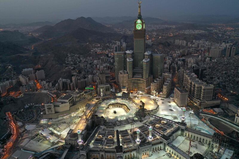 An aerial view of the Abraj al-Bait Makkah Royal Clock Tower overlooking the Grand Mosque and Kaaba in Makkah in the early hours of Eid Al Fitr as Saudi Arabia began a five-day, round-the-clock curfew. AFP