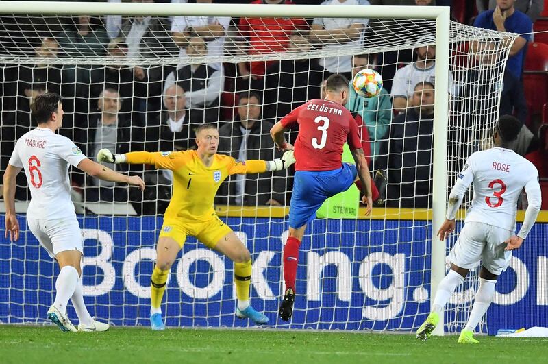 Czech Republic's Ondrej Celustka fails to score past England's goalkeeper Jordan Pickford during the UEFA Euro 2020 qualifier Group A football match Czech Republic v England at the Sinobo Arena.  AFP