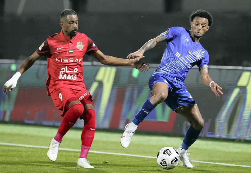 Sharjah, United Arab Emirates - Reporter: John McAuley. Sport. Shabab Al Ahli's Abdulaziz Haikal battles with Al Nasr's Ryan Mendes. Shabab Al Ahli v Al Nasr in the Arabian Gulf Cup Final. Friday, April 9th, 2021. Sharjah. Chris Whiteoak / The National