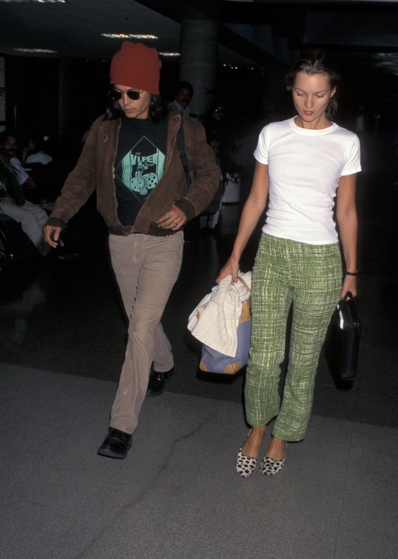 Johnny Depp and Kate Moss arrive at Los Angeles Airport from New York City on July 22, 1996. Getty Images
