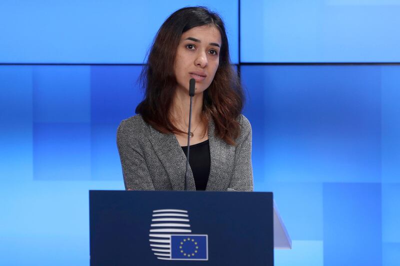 Nobel Peace Prize laureate Nadia Murad talks during a joint statement along with Nobel Peace Laureat Denis Mukwege and European Union Foreign Policy chief Federica Mogherini, at European Council's Europa building in Brussels, Monday, Nov. 26, 2018. The European Commission announced Monday a new support of 5million euros (5.6 million dollars) for the projects of the two laureates in fighting against victims of sexual violence. (AP Photo/Francisco Seco)