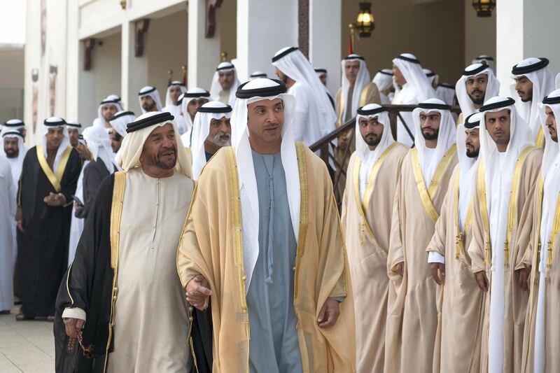 ABU DHABI, UNITED ARAB EMIRATES - January 21, 2018: HH Sheikh Suroor bin Mohamed Al Nahyan (L) and HH Sheikh Hazza bin Zayed Al Nahyan, Vice Chairman of the Abu Dhabi Executive Council (2nd L), attend a mass wedding reception for HH Sheikh Mubarak bin Hamdan bin Mubarak Al Nahyan (not shown), HH Sheikh Mohamed bin Ahmed bin Hamdan Al Nahyan (not shown) and other grooms, at Majlis Al Bateen.

( Mohamed Al Hammadi / Crown Prince Court - Abu Dhabi )
---
