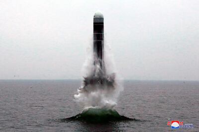 FILE - In this Oct. 2, 2019, file photo provided by the North Korean government, an underwater-launched missile lifts off in the waters off North Korea's eastern coastal town of Wonsan, North Korea. For months, North Korea has been relatively uncombative, as leader Kim Jong Un grapples with the coronavirus pandemic, a string of natural disasters and the deepening economic pain from years of tough U.S.-led sanctions. Korean language watermark on image as provided by source reads: "KCNA" which is the abbreviation for Korean Central News Agency. (Korean Central News Agency/Korea News Service via AP, File)