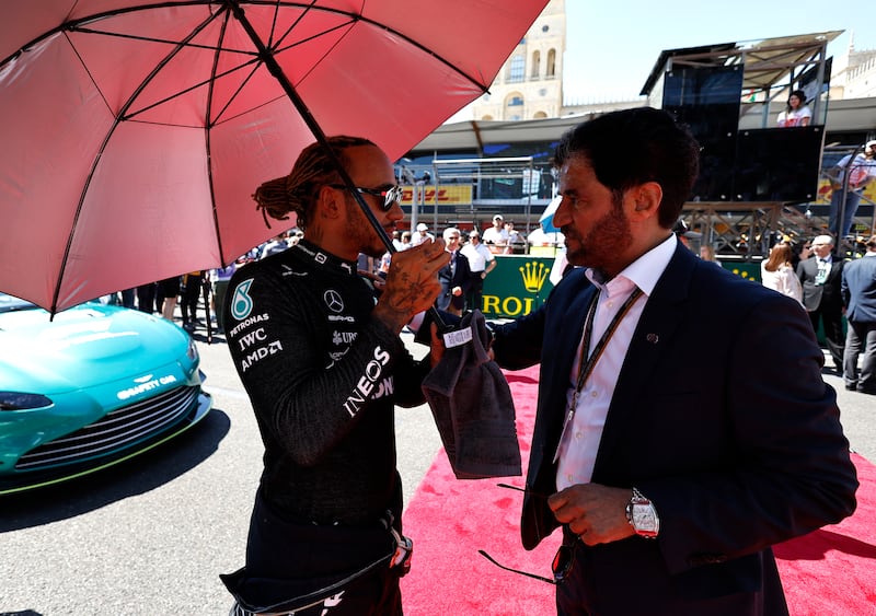 Mercedes' Lewis Hamilton with FIA president Mohammed Ben Sulayem on the grid before the Azerbaijan GP on June 12, 2022. Reuters