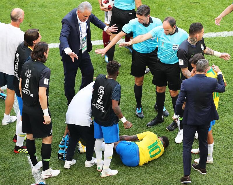 Neymar (bottom) of Brazil reacts next to his coach Tite (back centre) during the FIFA World Cup 2018 round of 16 match between Brazil and Mexico in Samara, Russia, 02 July 2018. EPA