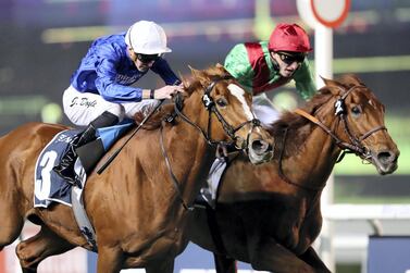 Magic Lily, left, ridden by James Doyle, races to victory at Meydan. Chris Whiteoak / The National