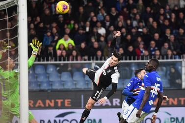 Juventus forward Cristiano Ronaldo leaps above the Sampdoria defence to score the winner. EPA