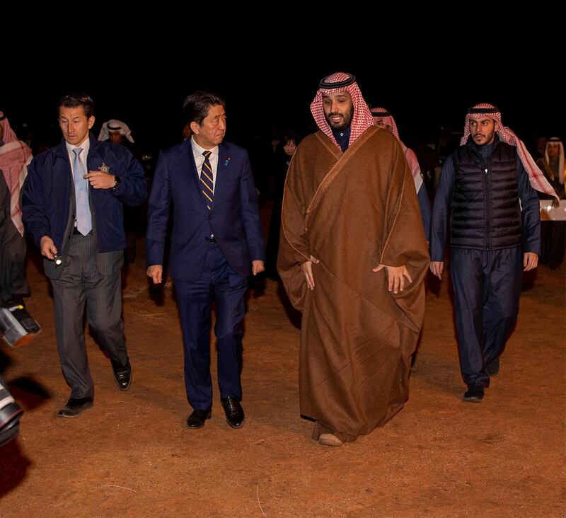 Crown Prince Mohammed bin Salman walks with Mr. Abe during a meeting in Riyadh.