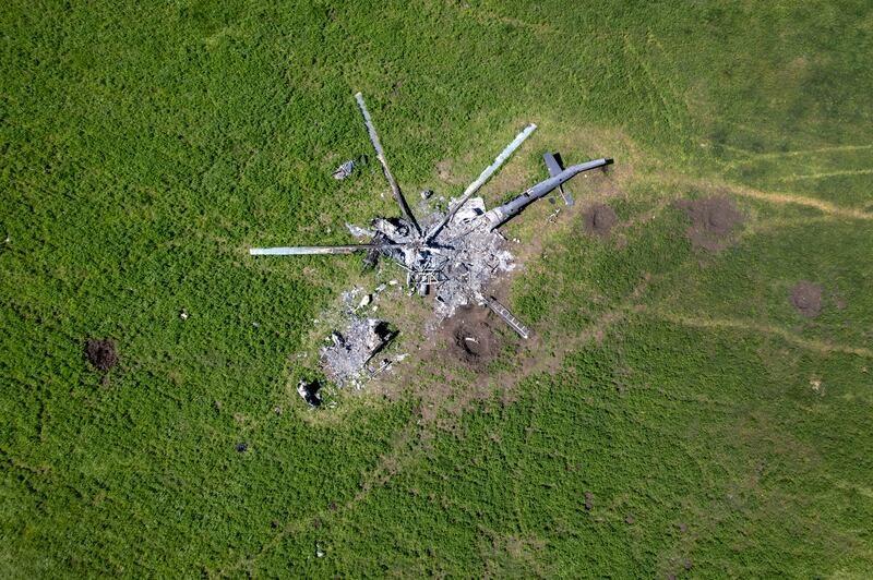 The remains of a Russian helicopter lie in a bomb-cratered field on May 16, in Biskvitne, Ukraine. Ukrainian and western officials say Russia is withdrawing forces around Kharkiv, and it may now redirect troops to Ukraine's south-east. Getty Images