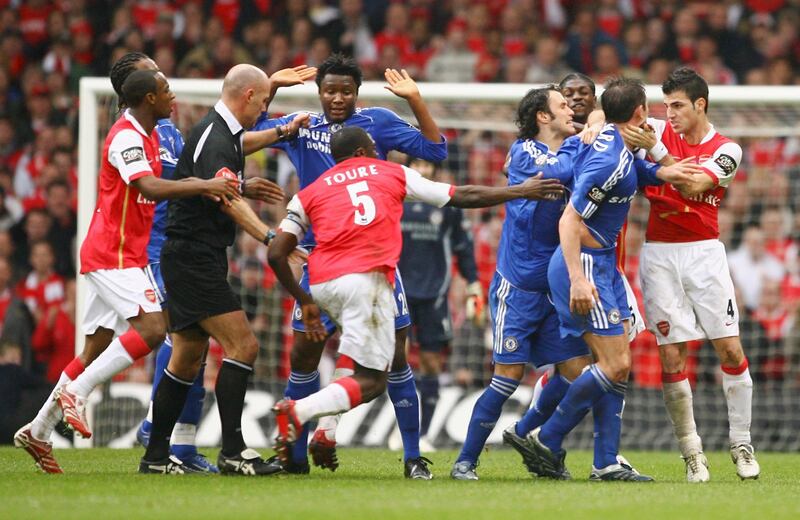 CARDIFF, UNITED KINGDOM - FEBRUARY 25:  Referee Howard Webb attempts to difuse a brawl between the  Arsenal and Chelsea players during the Carling Cup Final match between Chelsea and Arsenal at the Millennium Stadium on February 25, 2007 in Cardiff, Wales.  (Photo by Clive Mason/Getty Images)