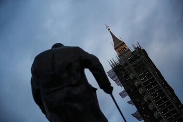 A view shows a statue of Winston Churchill standing in front of Big Ben amidst the spread of the coronavirus disease (COVID-19) pandemic, in London, Britain December 24, 2020. REUTERS/Hannah McKay
