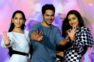 Bollywood actors Nora Fatehi, Varun Dhawan and Shraddha Kapoor pose for photographs during the trailer launch of the upcoming Hindi dance film 'Street Dancer 3D' in Mumbai on December 18, 2019. AFP 