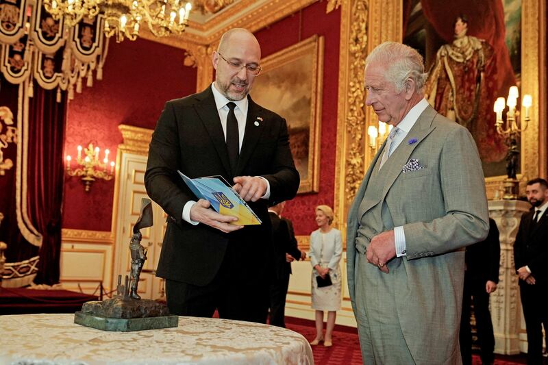 King Charles and Ukrainian Prime Minister Denys Shmyhal attend a reception at St James's Palace. Reuters
