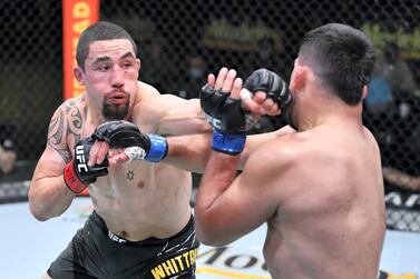 Robert Whittaker punches Kelvin Gastelum in their middleweight fight during the UFC Fight Night event at UFC APEX on April 17, 2021 in Las Vegas, Nevada. (Photo by Chris Unger/Zuffa LLC)