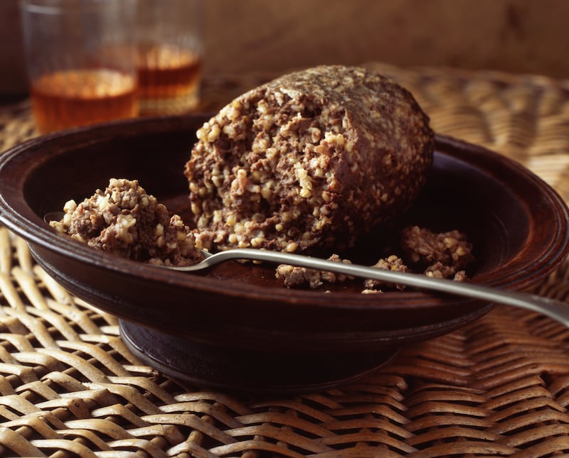 Haggis typically comprises sheep's heart, liver and lungs, with onion, oatmeal and suet, cooked encased in the animal's stomach. Getty