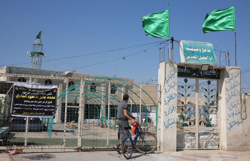 An Iraqi stands in front of the the Abu al-Fadhel al-Abbas mosque in Baghdad's al-Turath district. AFP