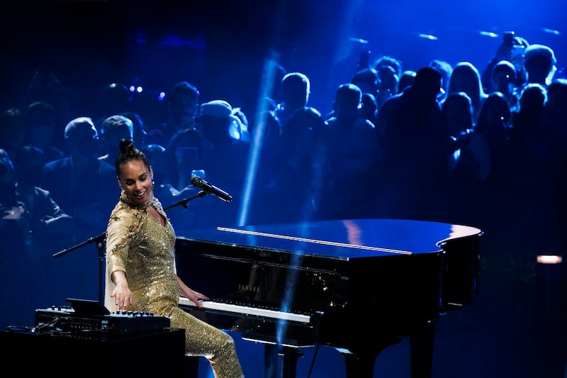 A dance troupe kept a low profile around the circular stage. AP