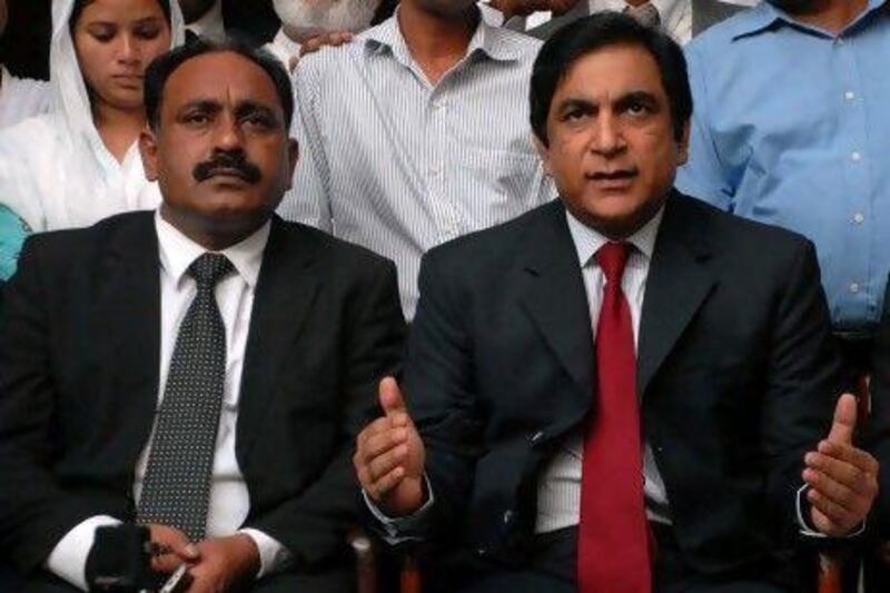 Paul Bhatti, right, the minister for national harmony, said that the Pakistani government would "talk to authorities" to ensure that Rimsha Masih will be protected. Mr Bhatti addressed the media with one of Rimsha's lawyers, Tahir Naveed Chaudhry, right, after the girl was granted bail after being arrested for alleged blashphemy. W Khan / EPA