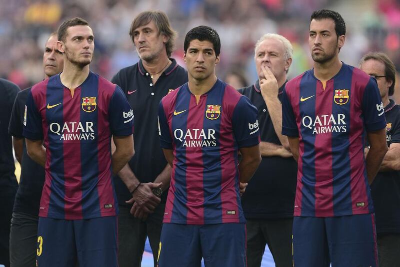Barcelona defender Thomas Vermaelen, left,, forward Luis Suarez, centre, and midfielder Sergio Busquets, right, stand together before Barca's friendly against Leon on Monday night at the Camp Nou. Josep Lago / AFP  