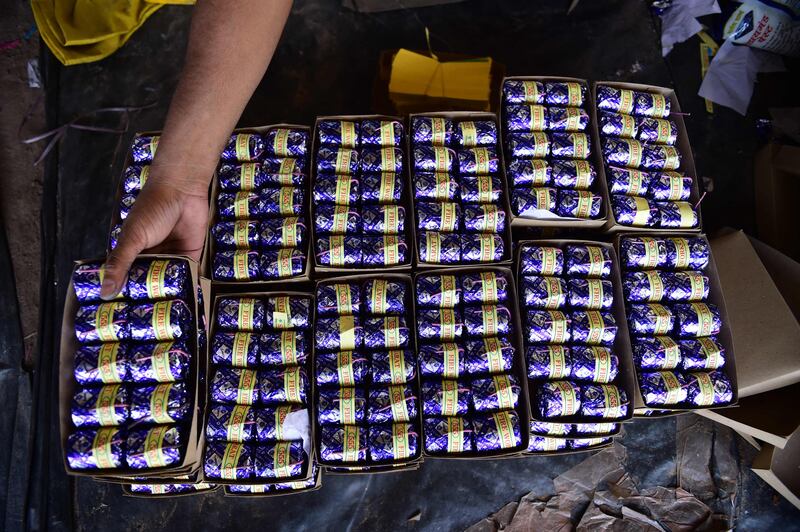 Workers stack finished firecrackers at a workshop in Ahmedabad. AFP