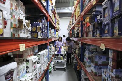 DUBAI, UNITED ARAB EMIRATES , Feb 18  – 2020 :- Staff arranging the customer’s order at the Bulk Whiz warehouse in Al Quoz 4 in Dubai. Bulk Whiz is the Dubai based bulk grocery e-commerce platform. (Pawan  Singh / The National) For Business. Story by Nada