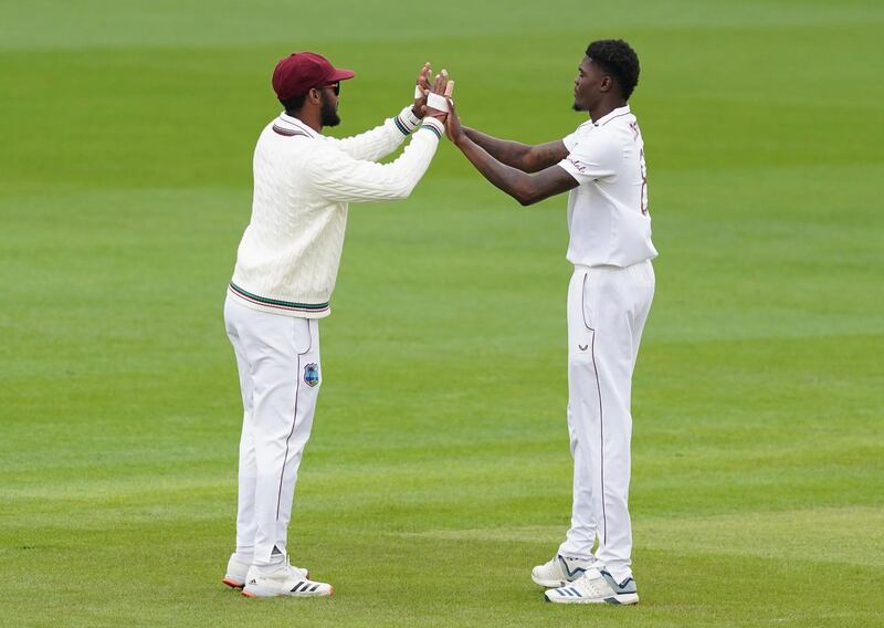 West Indies' Alzarri Joseph, right, celebrates the dismissal Joe Root. AP