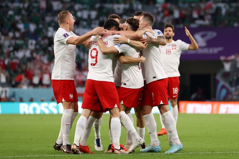 Poland's Piotr Zielinski celebrates with teammates after scoring the first goal in the Group C match against Saudi Arabia at Education City Stadium on November 26, 2022. Getty