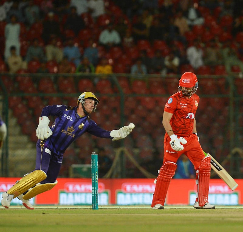 Quetta Gladiators wicketkeeper Laurie Evans goes for a possible catch of Islamabad United's Haider Ali. EPA