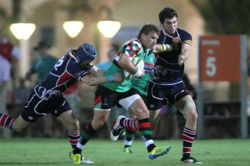 Jeremy Manning, centre, scored four penalties and a try against Jebel Ali Dragons on his debut for Abu Dhabi Harlequins. Jaime Puebla / The National