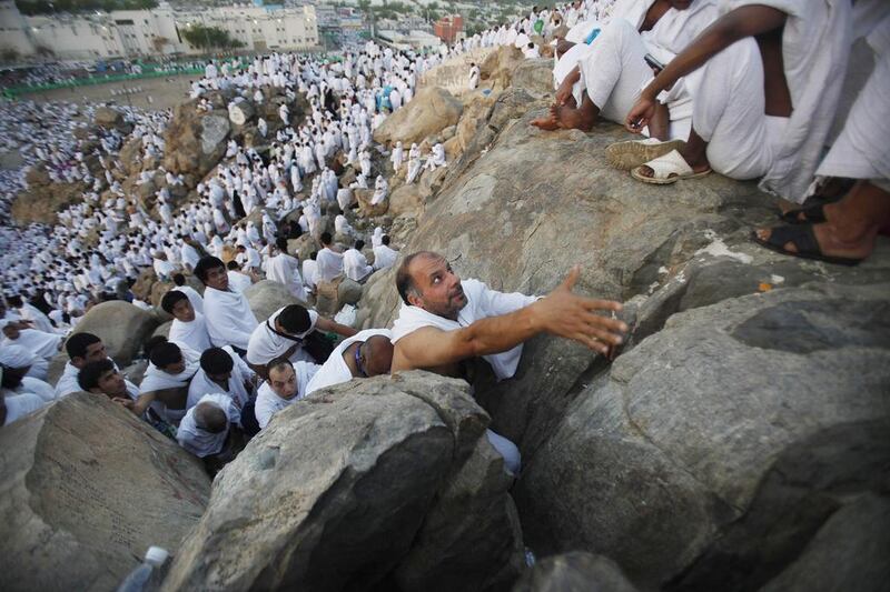Muslim pilgrims climb Mount Mercy on the plains of Arafat during the peak of the annual haj pilgrimage, near the holy city of Mecca. Reuters/Ibraheem Abu Mustafa 