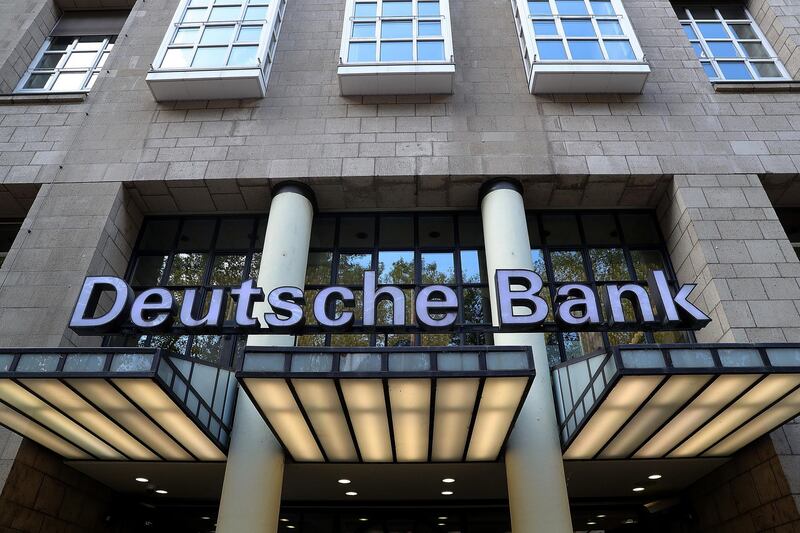A sign sits above the entrance of a Deutsche Bank AG bank branch in Duesseldorf, Germany, on Wednesday, Aug. 14, 2019. Deutsche Bank Supervisory Board Chairman Paul Achleitner is searching for his successor after overseeing a tumultuous period marked by multiple restructurings, top management changes and a slumping share price. Photographer: Krisztian Bocsi/Bloomberg