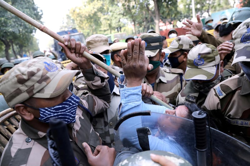 A protester is surrounded by security personnel at a demonstration in support of farmers, in New Delhi, India. Reuters