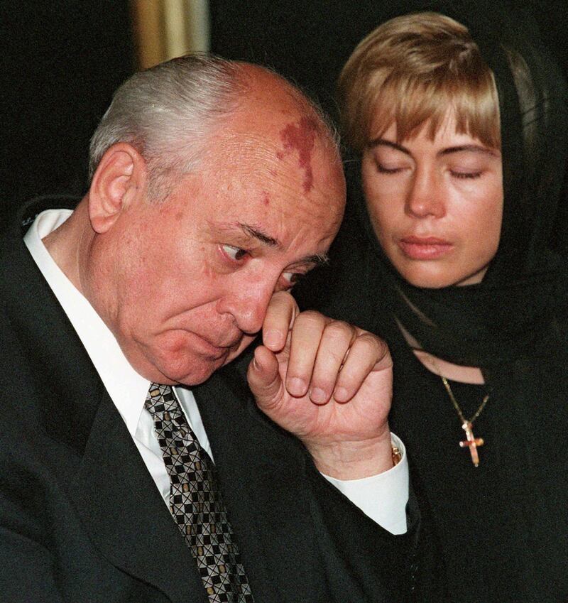 Gorbachev wipes his tears as his daughter Irina looks on during a ceremony in Moscow to pay tribute to his late wife Raisa in September 1999. AFP