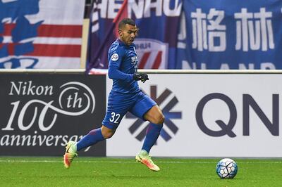 SHANGHAI, CHINA - FEBRUARY 08:  Carlos Tevez #32 of Shanghai Shenhua drives the ball during the AFC Champions League 2017 play-off match between Shanghai Shenhua and Brisbane Roar at Hongkou Stadium on February 8, 2017 in Shanghai, China.  (Photo by VCG/VCG via Getty Images) *** Local Caption ***  sp22fe-numbers-tevez.jpg