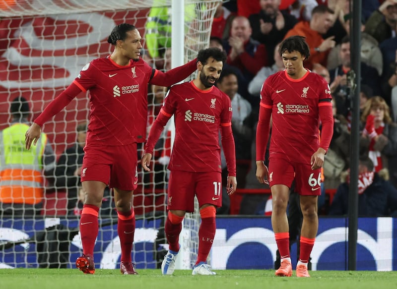 Mohamed Salah celebrates scoring their second goal with teammates. Reuters