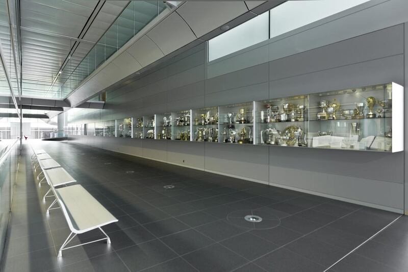 At the McLaren Technology Centre the many trophies the firm's racing cars have won are displayed in a wall of cabinets. Courtesy: McLaren