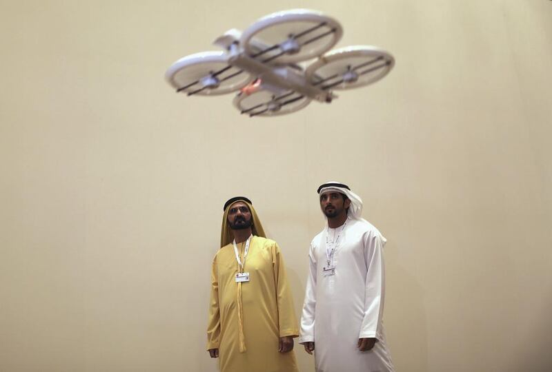 Sheikh Mohammed bin Rashid, Vice President and Ruler of Dubai, and his son, Sheikh Hamdan bin Mohammed, Crown Prince of Dubai, watch a recent demonstration of an unmanned aerial drone. Ahmed Jadallah / Reuters